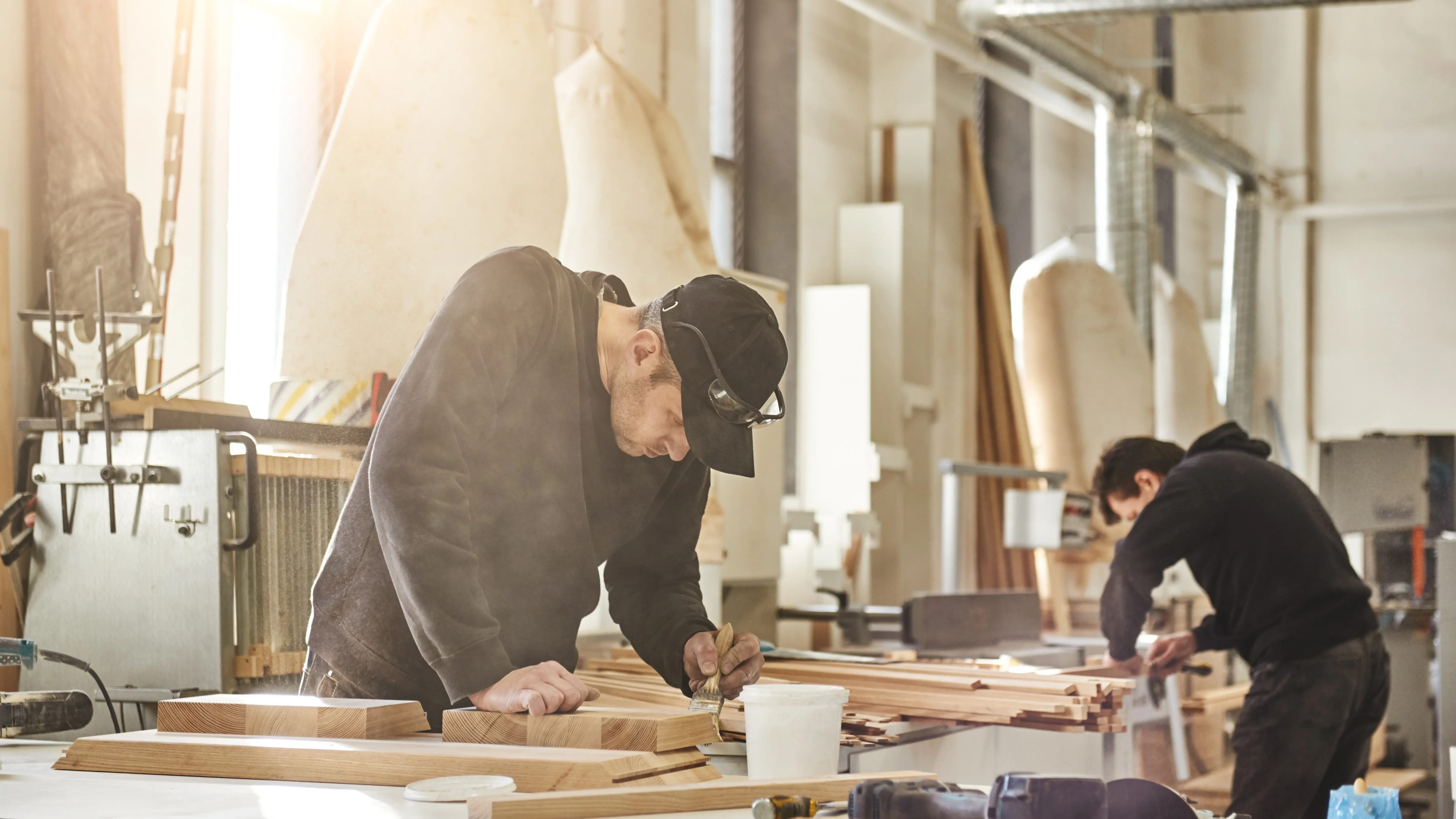 man working on building projects in wood shop